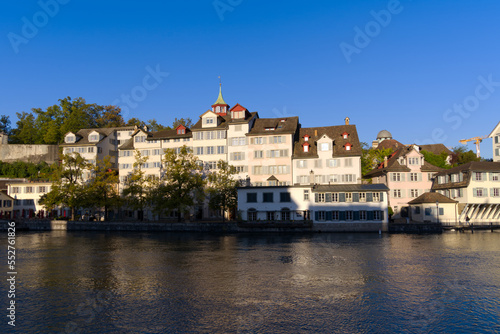 Scenic view of the old town of City of Zürich with Limmat River and historic houses on a sunny late summer morning. Photo taken September 22nd, 2022, Zurich, Switzerland.