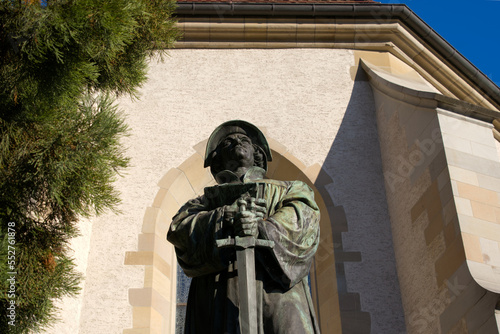 Bronze statue of reformer Ulrich Zwingli at the old town of Zurich on a beautiful late summer morning. Photo taken September 22nd, 2022, Zurich, Switzerland. photo