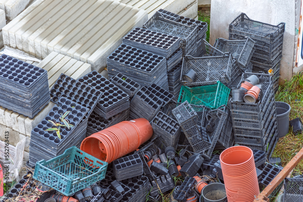 Lots of plastic crates, pots and other gardening tools for growing