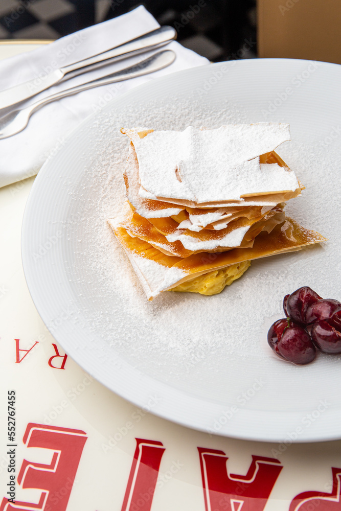 Dessert millefeuille with custard and cherry Dessert millefeuille with custard and cherry