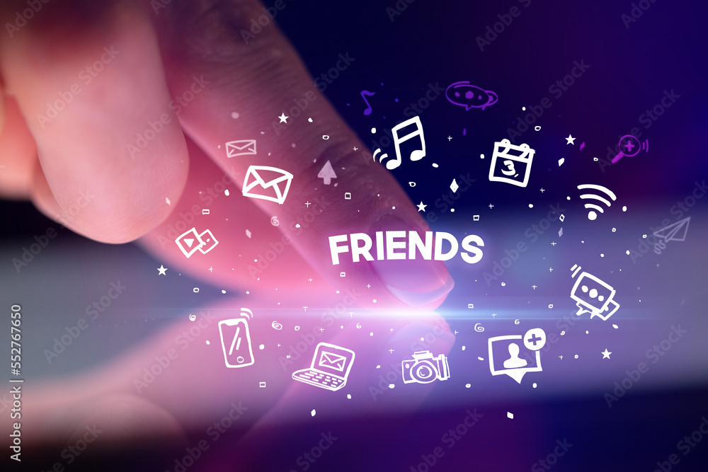 Finger touching tablet with social media icons concept Finger touching tablet with social media icons concept
