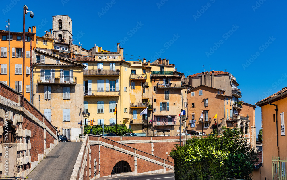 Old town quarter south slope with historic tenement houses and walls over Bulevard Fragonard street in perfumery city of Grasse in France