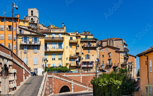 Old town quarter south slope with historic tenement houses and walls over Bulevard Fragonard street in perfumery city of Grasse in France