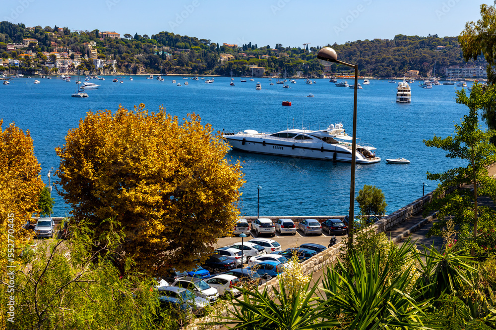 Panoramic view of harbor and yachts offshore Azure Cost of Mediterranean Sea in Villefranche-sur-Mer resort town in France
