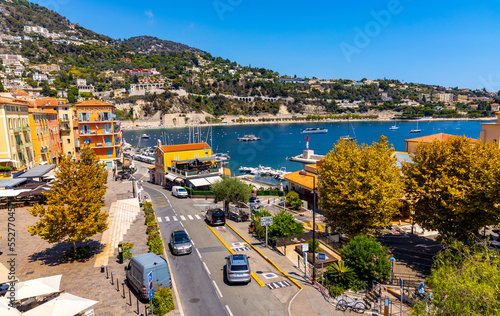 Panoramic view of harbor, yacht marina and beach onshore Mediterranean Sea in Villefranche-sur-Mer resort town in France photo