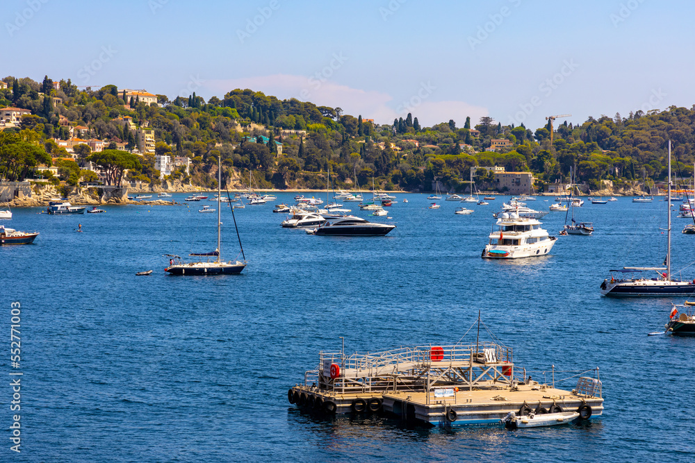 Panoramic view of harbor and beach onshore Azure Cost of Mediterranean Sea in Villefranche-sur-Mer resort town in France