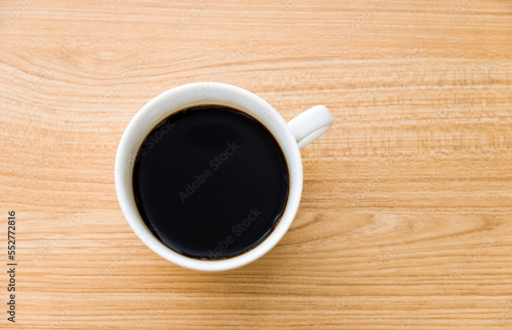 Cup of coffee on wooden table Cup of coffee on wooden table