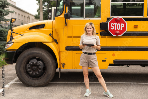 a woman near a school bus