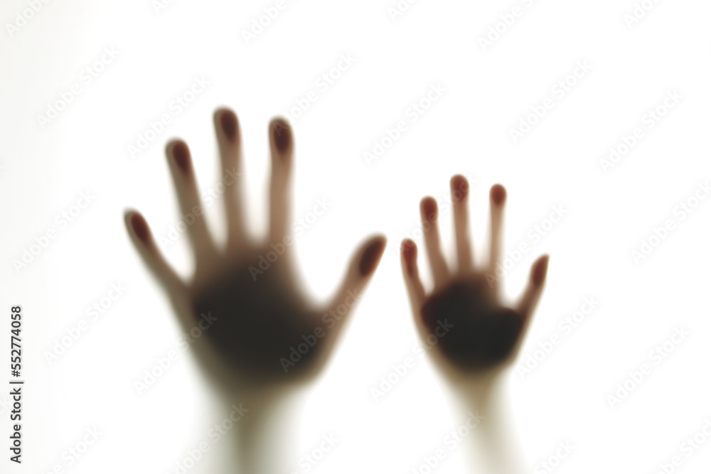 Blurred shadows of hands behind glass, concept of ghosts, zombies, walking corpses