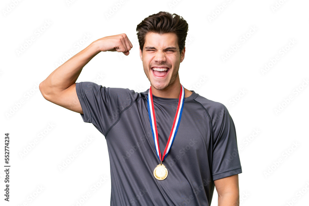 Young caucasian man with medals over isolated background doing strong gesture Young caucasian man with medals over isolated background doing strong gesture