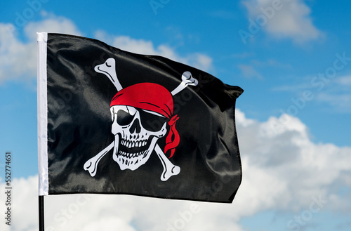 Pirate flag waving on sky