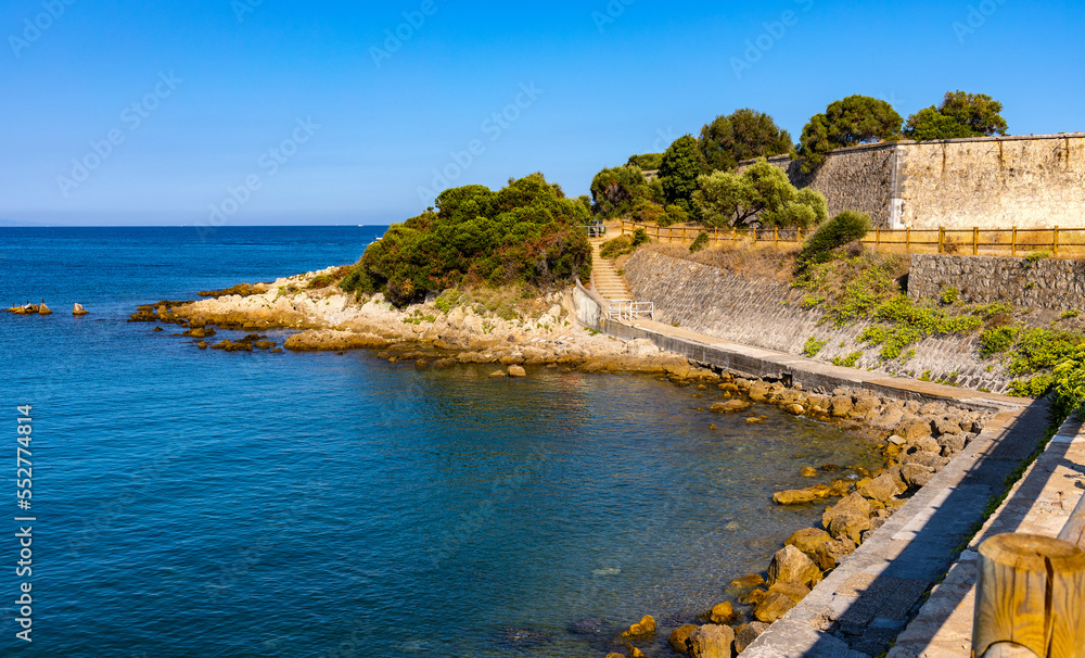 Panoramic view of French Rivera rocky coastline of Pointe Belaye cape at Antibes resort city harbor onshore Azure Cost of Mediterranean Sea in France