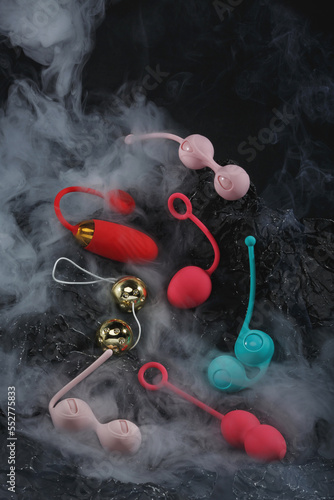 Vaginal balls in puffs of smoke on a black background Geisha balls Sex toys Sex shop concept Adult store Women's sexual health Boost sex Kegel balls help strengthen the muscles of the pelvic floor