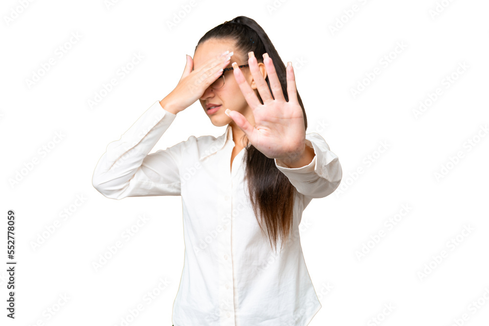 Young Arabian woman over isolated chroma key background making stop gesture and covering face Young Arabian woman over isolated chroma key background making stop gesture and covering face
