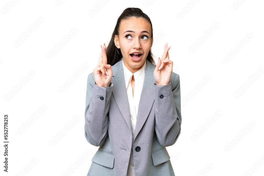 Young Arabian woman over isolated chroma key background with fingers crossing and wishing the best Young Arabian woman over isolated chroma key background with fingers crossing and wishing the best