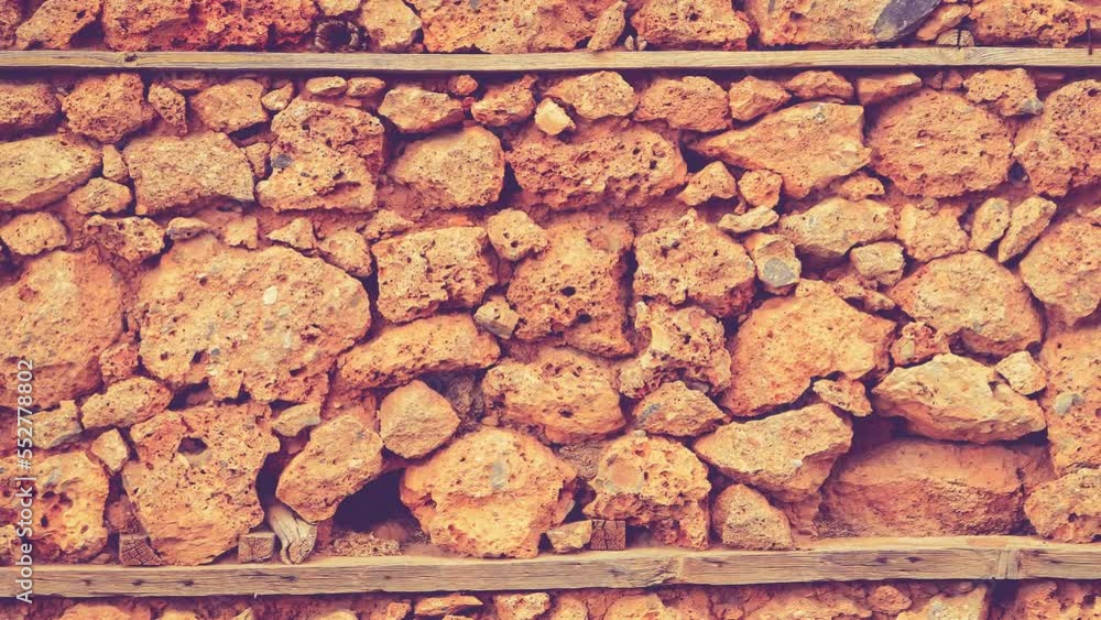 House of coquina cobblestones layers wall texture seamless loop