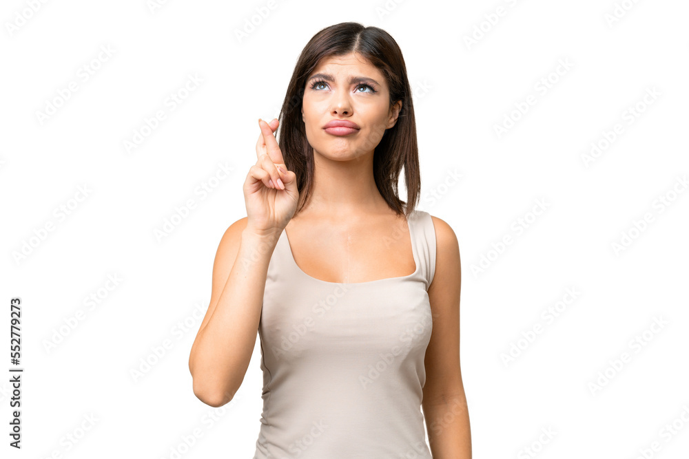 Young Russian woman over isolated chroma key background with fingers crossing and wishing the best Young Russian woman over isolated chroma key background with fingers crossing and wishing the best