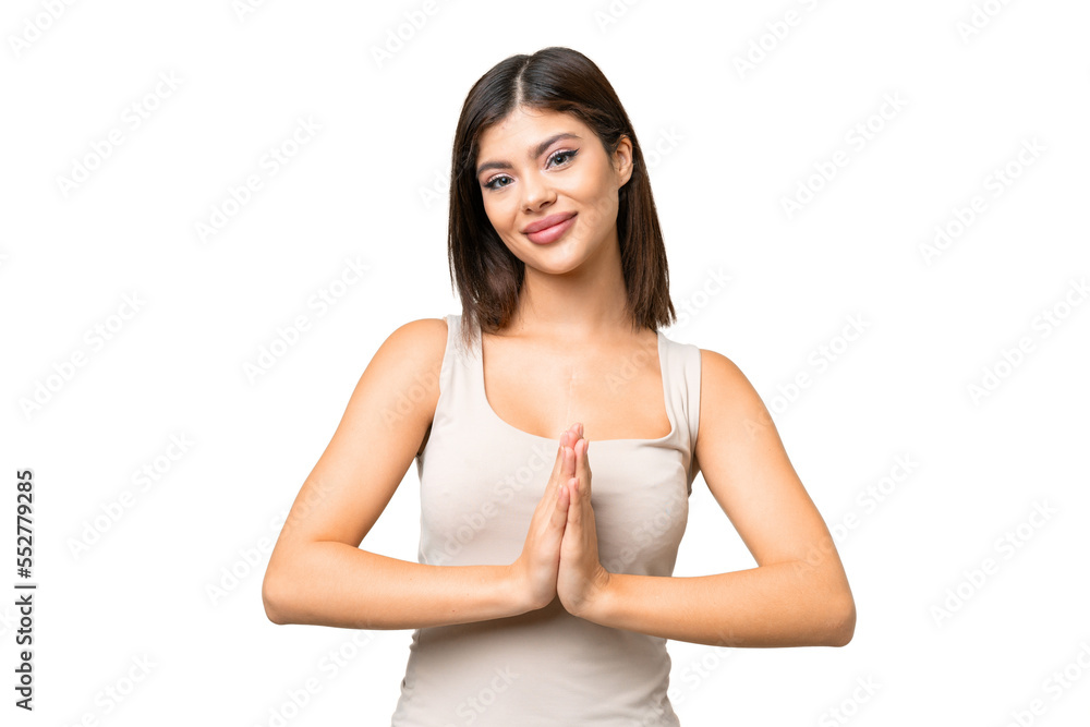 Young Russian woman over isolated chroma key background keeps palm together. Person asks for something Young Russian woman over isolated chroma key background keeps palm together. Person asks for something
