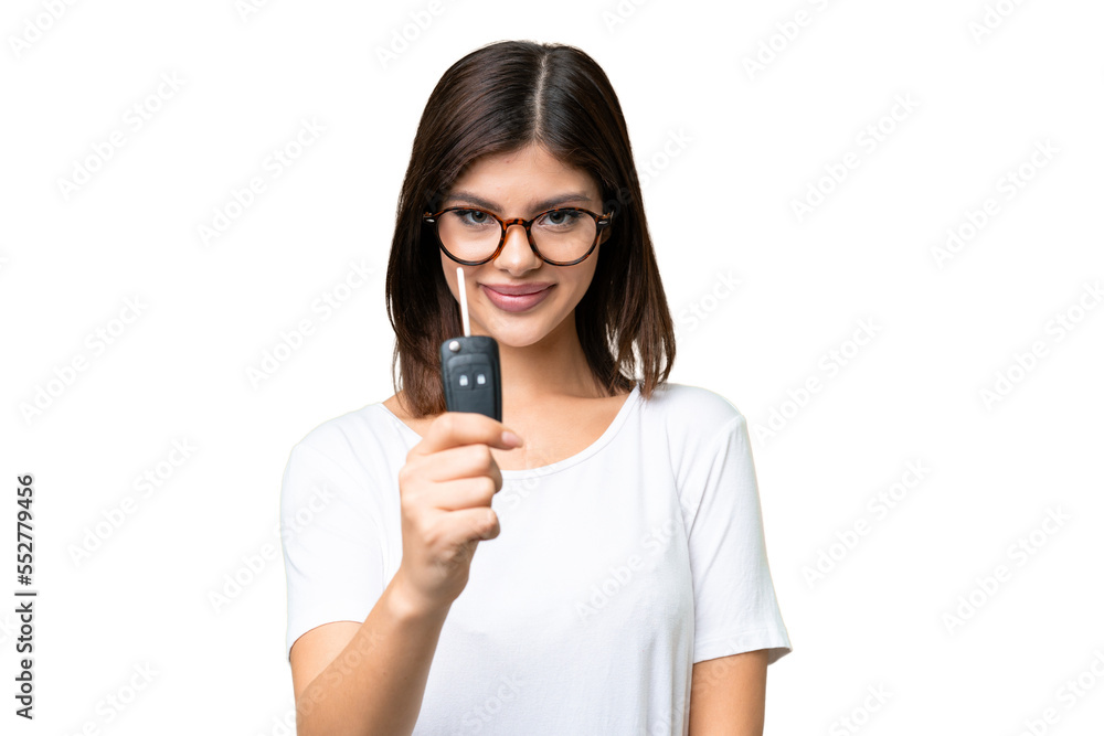 Young Russian woman holding car keys over isolated chroma key background with happy expression Young Russian woman holding car keys over isolated chroma key background with happy expression