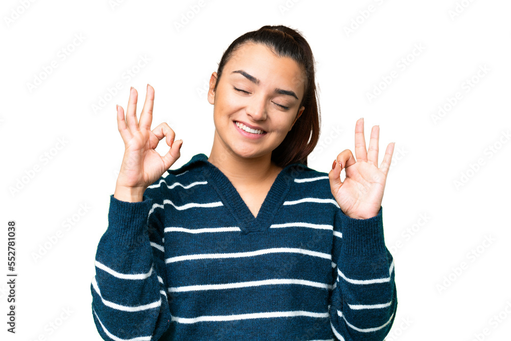 Young beauty woman over isolated chroma key background in zen pose