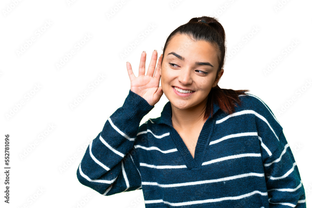 Young beauty woman over isolated chroma key background listening to something by putting hand on the ear Young beauty woman over isolated chroma key background listening to something by putting hand on the ear