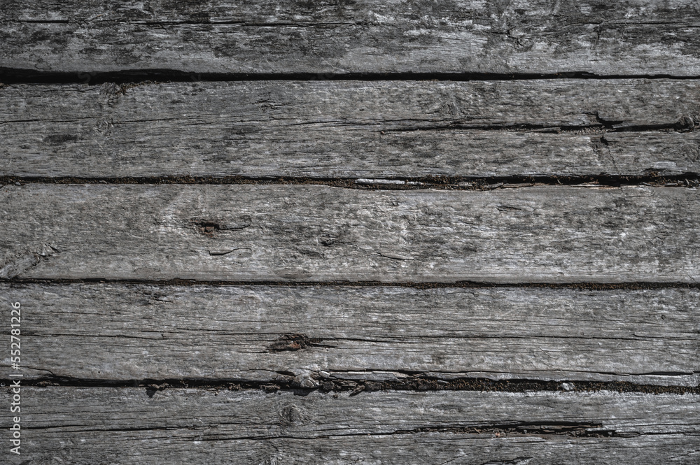Textured wooden surface full of cracks. Textured wooden surface full of cracks.
