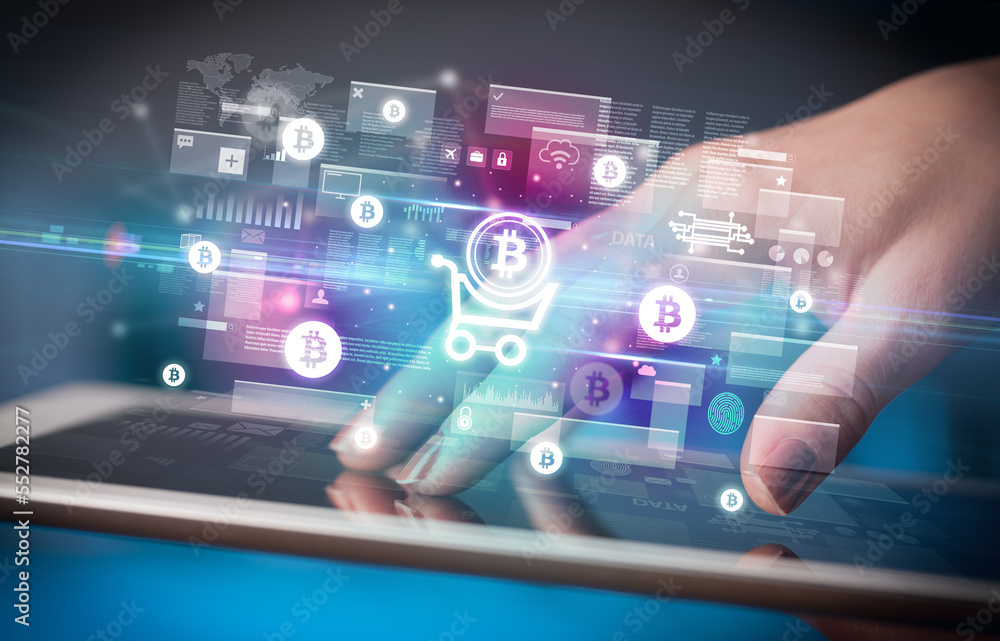 Close-up of a hand using tablet, currency concept Close-up of a hand using tablet, currency concept