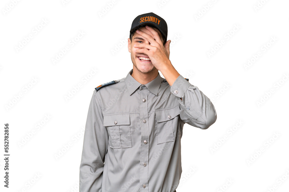 Young security man over isolated background covering eyes by hands and smiling Young security man over isolated background covering eyes by hands and smiling
