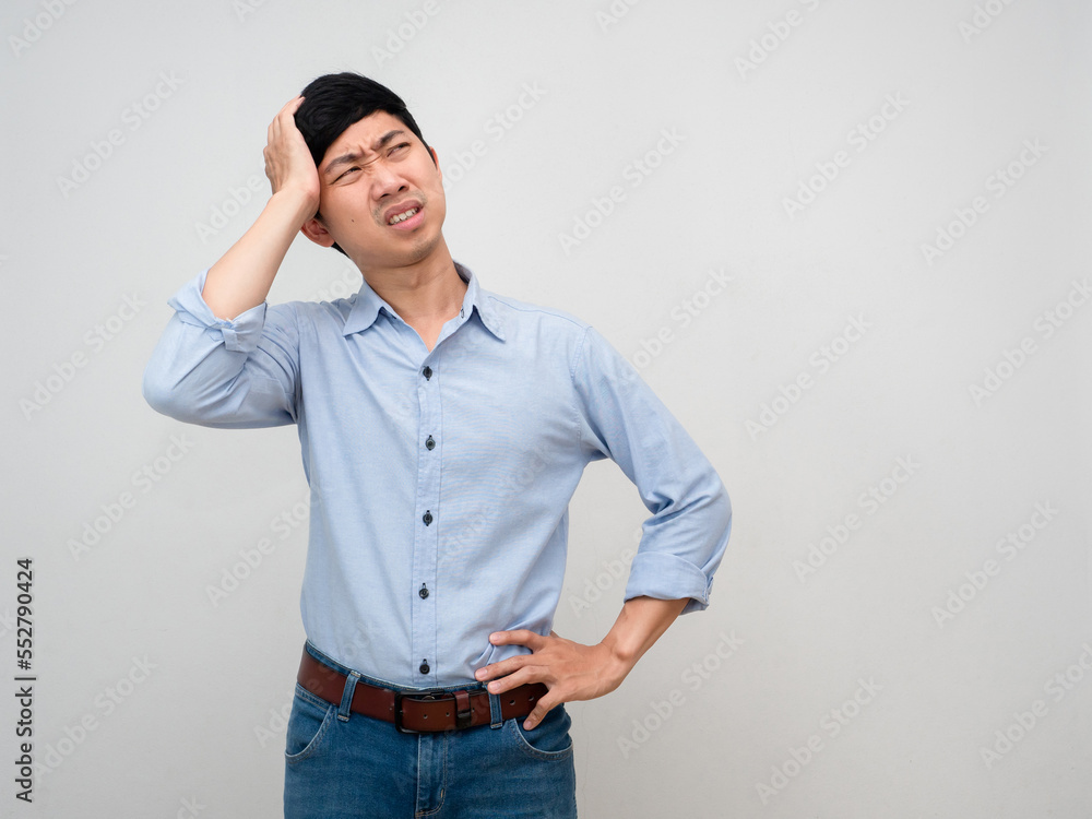 Asian businessman blue shirt hold his head feels headache and strain tried from working isolated Asian businessman blue shirt hold his head feels headache and strain tried from working isolated