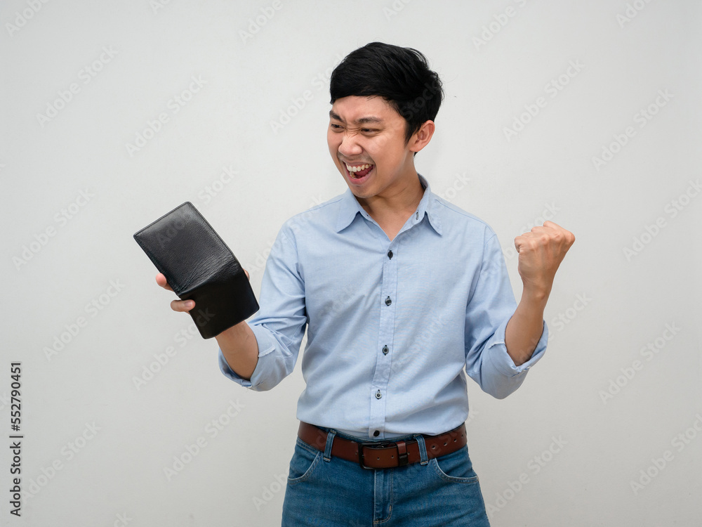 Asian businessman holding wallet feels satisfied happy show fist up about rich isolated Asian businessman holding wallet feels satisfied happy show fist up about rich isolated