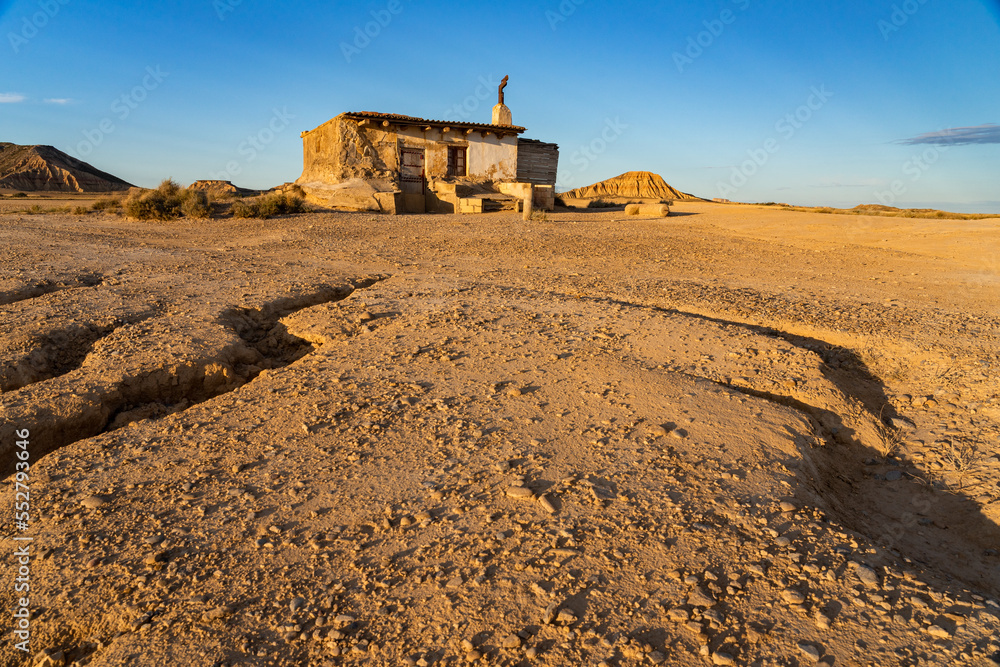 Small hut in the Desert area of Las Bardenas Reales in Navarra at sunset, Spain