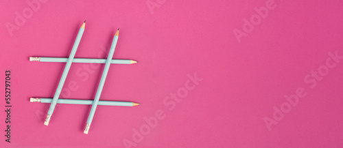 Hashtag made from pencils  social media communication  influencer and followers  viral content trend  pink color 