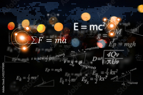 Mathematical and physics equations of Albert Einstein and Sir Isaac Newton and other equations on black background. photo