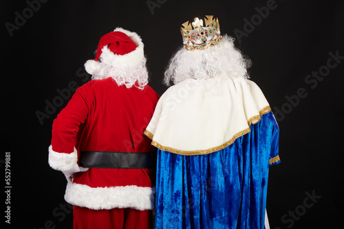 Wise Man and Santa Claus with their backs to camera