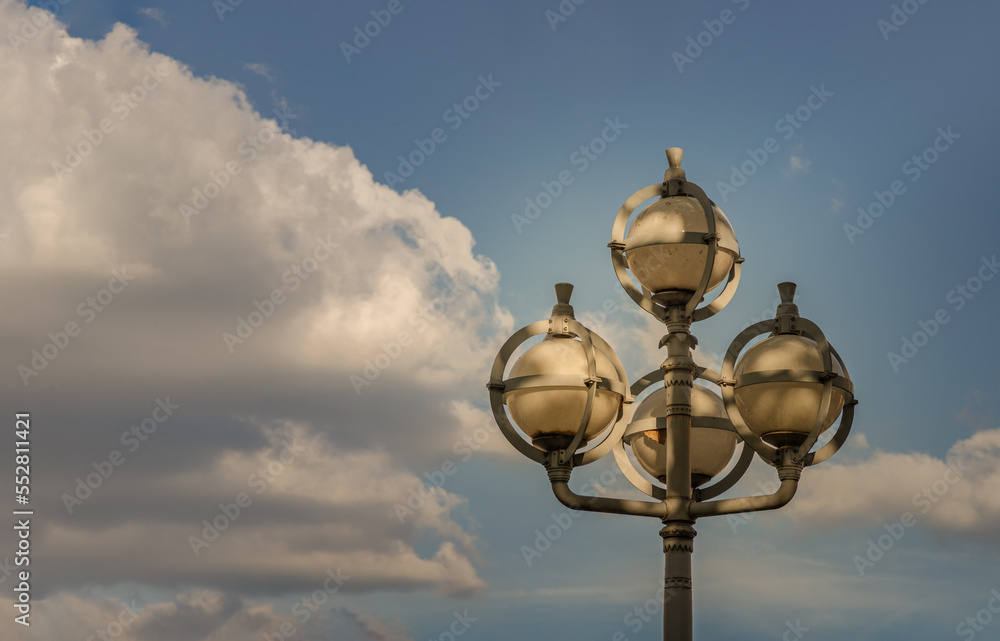 Bangkok, Thailand - Dec 07, 2022 - Street lamps on Metal pole against the background of cloudy blue sky by Afternoon sun. Space for text, Selective focus.