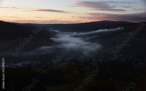 view of the evening valley with fog