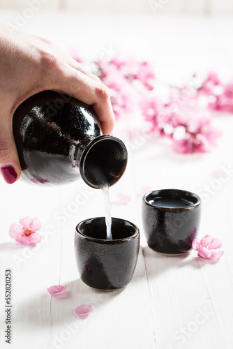 Special Japanese sake in small black ceramics.