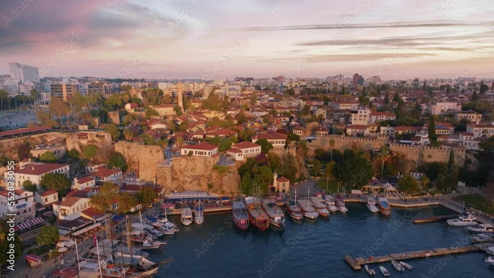 Panorama of the historic city on the seashore. Aerial video footage from a drone. Harbor with motorboat and sailboat. Panorama of the historic city on the seashore. Aerial video footage from a drone. Harbor with motorboat and sailboat.