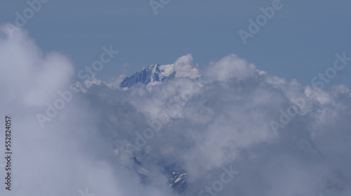 Top of Mont Blanc in clouds seen from Switzerland