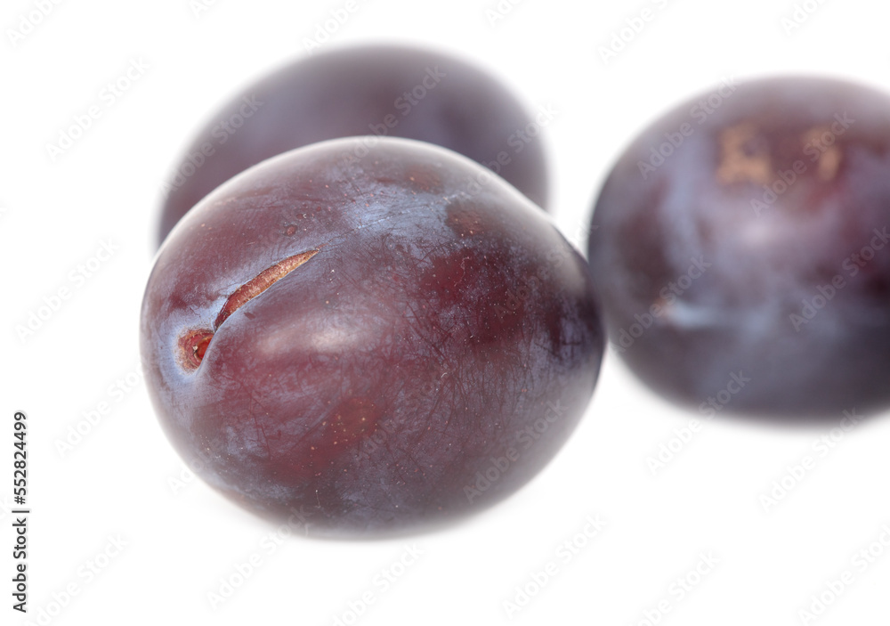 Ripe plum berries isolated on white background.