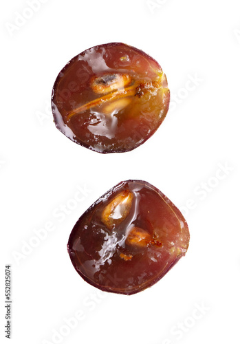 Sliced red grape isolated on white background.