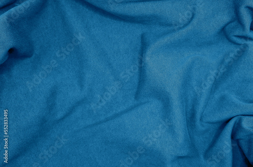 blue coarse calico fabric. canvas blue cloth texture background used for calico textile, wavy fabric background. crumpled fabric texture background. trendy color fabric use as background.