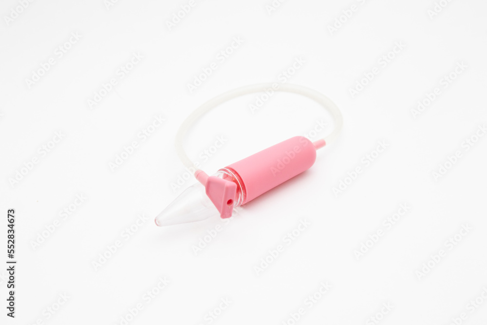 Pink aspirator. Medical item to suck discharge from the nose of an infant on a white background Pink aspirator. Medical item to suck discharge from the nose of an infant on a white background