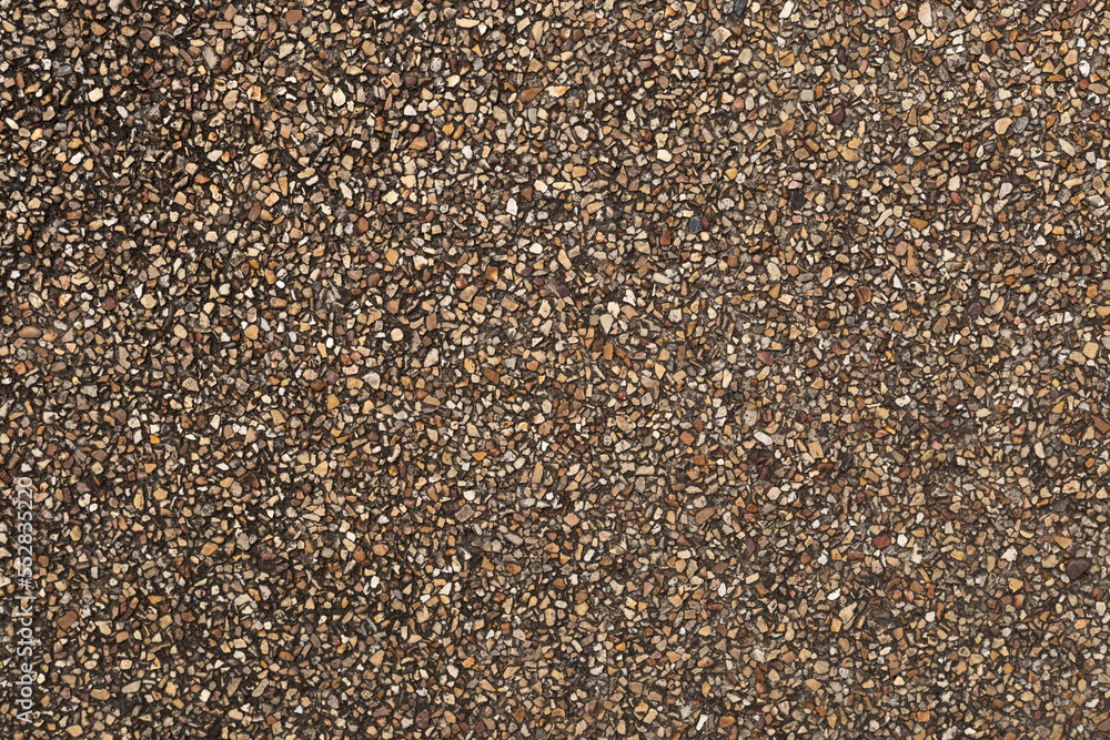 The pattern small brown pebbles stone as background. pebbles texture wall and floor. The pattern small brown pebbles stone as background. pebbles texture wall and floor.