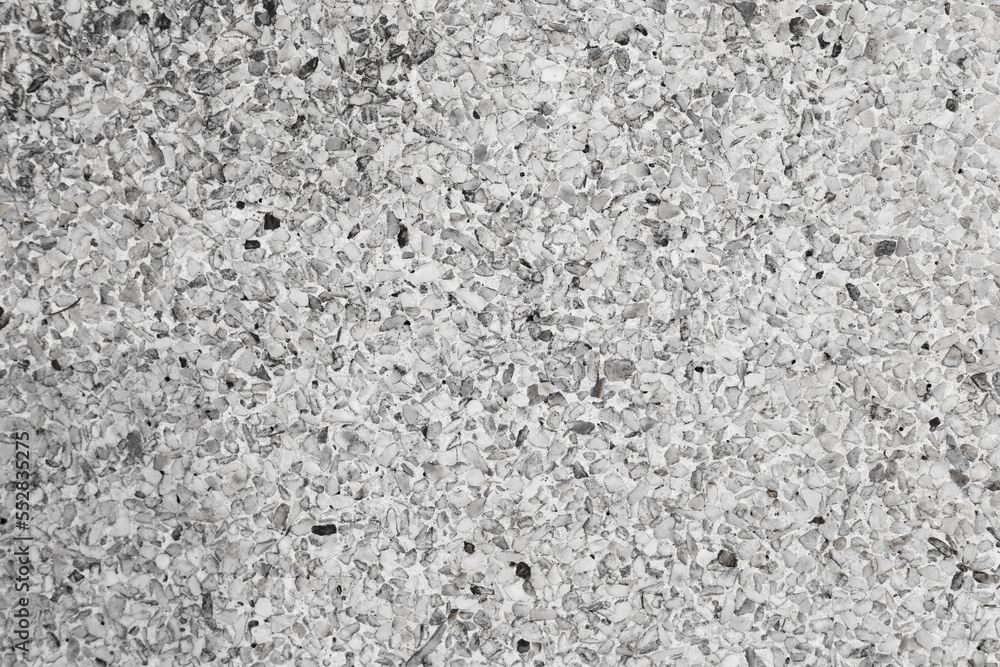 The pattern small grey pebbles stone as background. pebbles texture wall and floor. The pattern small grey pebbles stone as background. pebbles texture wall and floor.