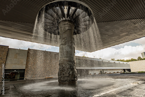 Outside view of Anthropological Museum in Mexico City, Mexico. Fountain at the entrance of Museum photo