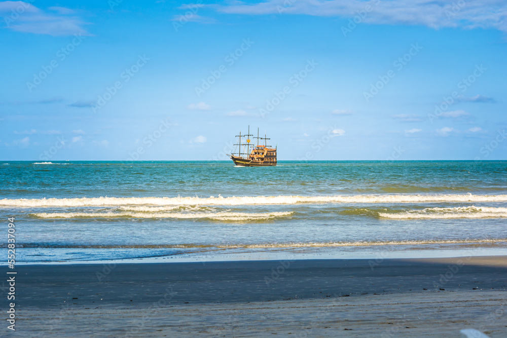 pirate boat sailing near the coast or beach, atlantic ocean pirate boat sailing near the coast or beach, atlantic ocean