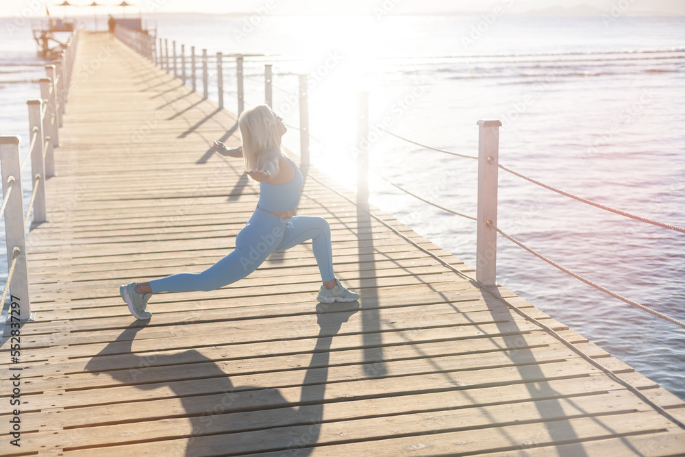 woman exercising on pontoon Red Sea