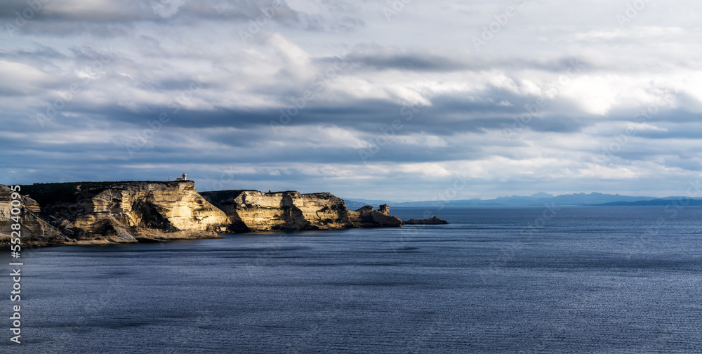 panorama landscape of the cliffs at Bonifacio with the Pentusatu Lighthouse in the distance