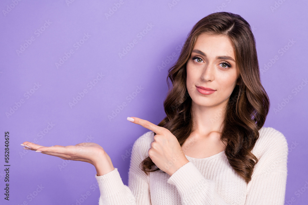 Photo of pretty cute lady arm direct empty space demonstrate empty blank space banner novelty isolated on purple color background Photo of pretty cute lady arm direct empty space demonstrate empty blank space banner novelty isolated on purple color background